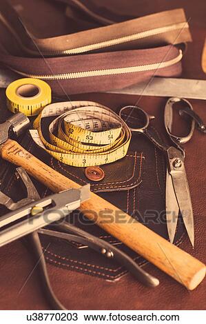 Still life of dressmaking equipment in leather jacket manufacturers, close-up View Large Photo Image Stock Image - Still life of dressmaking equipment in leather jacket manufacturers, close-up. Fotosearch