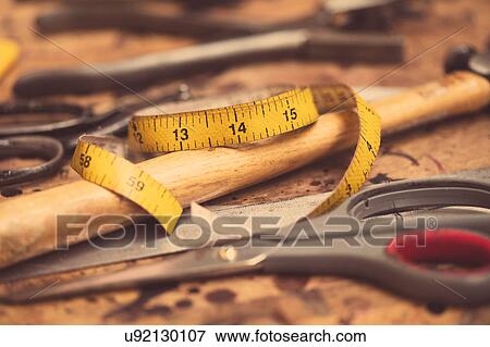Still life of dressmaking equipment in leather jacket manufacturers, close-up View Large Photo Image Stock Photo - Still life of dressmaking equipment in leather jacket manufacturers, close-up. Fotosearch