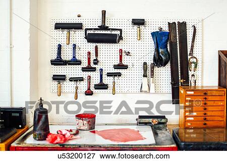 Stock Photo - Still life of rollers, ink and equipment in print workshop. Fotosearch