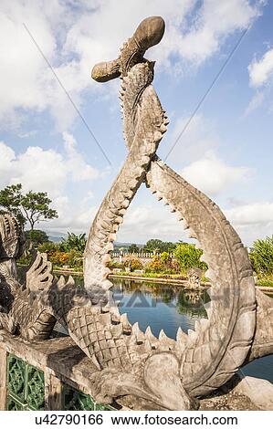 Stone dragon sculpture and pond, Amlapura, Bali, Indonesia View Large Photo Image Stock Photograph - Stone dragon sculpture and pond, Amlapura, Bali, Indonesia. Fotosearch