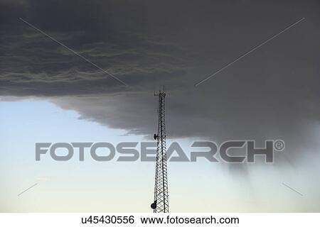 Storm clouds gathering above communications tower View Large Photo Image Stock Photograph - Storm clouds gathering above communications tower. Fotosearch