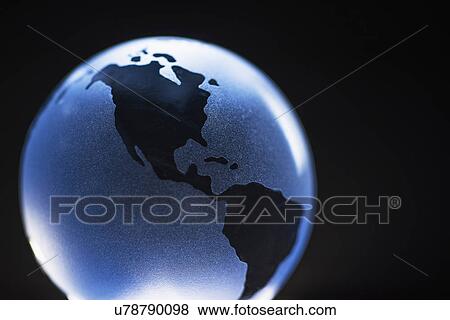 Stock Photo - Studio shot of glass globe. Fotosearch