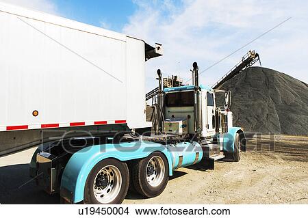 Picture - Truck in gravel quarry. Fotosearch