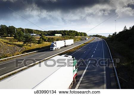 Picture - Trucks on highway. Fotosearch