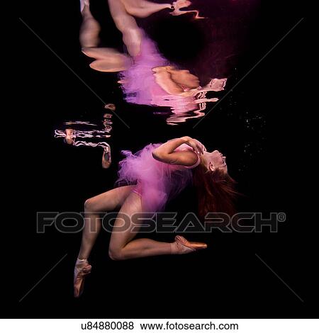 Underwater view of girl wearing tutu and ballet shoes, floating towards water surface View Large Photo Image Stock Photo - Underwater view of girl wearing tutu and ballet shoes, floating towards water surface. Fotosearch