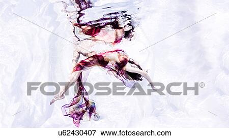 Underwater view of woman draped in sheer fabric, bending backwards View Large Photo Image Stock Photo - Underwater view of woman draped in sheer fabric, bending backwards. Fotosearch