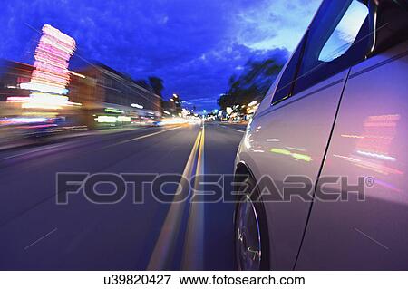 USA, Colorado, Denver, Car on city street at dusk View Large Photo Image Stock Photo - USA, Colorado, Denver, Car on city street at dusk. Fotosearch