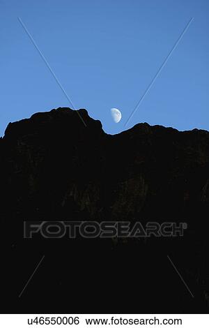 USA, Colorado, Moon over silhouette of rocks in Roxborough State Park View Large Photo Image Stock Photograph - USA, Colorado, Moon over silhouette of rocks in Roxborough State Park. Fotosearch