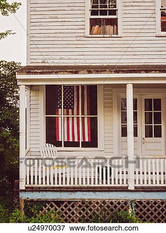 USA, Maine, Knox, American flag hanging in house View Large Photo Image Stock Photo - USA, Maine, Knox, American flag hanging in house. Fotosearch