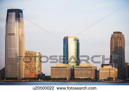 USA, New Jersey, Jersey City, City skyline seen across Hudson River View Large Photo Image Stock Image - USA, New Jersey, Jersey City, City skyline seen across Hudson River. Fotosearch