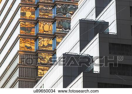 Picture - USA, New York, New York City, Glass facade of office building. Fotosearch