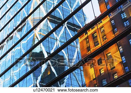 Stock Image - USA, New York, New York City, Glass facade of office building. Fotosearch