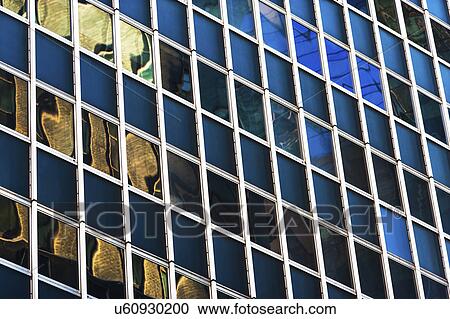 USA, New York, New York City, Glass facade of office building View Large Photo Image Stock Image - USA, New York, New York City, Glass facade of office building. Fotosearch