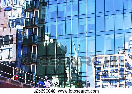 USA, New York, New York City, Glass facade of office building View Large Photo Image Stock Photo - USA, New York, New York City, Glass facade of office building. Fotosearch