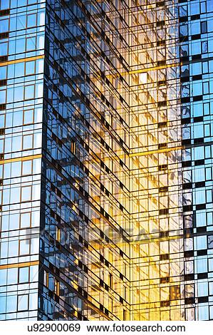 Stock Photo - USA, New York, New York City, Glass facade of office building. Fotosearch