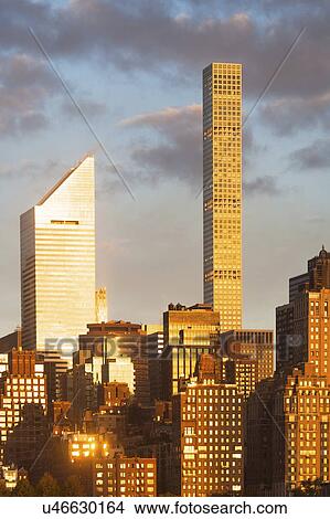 USA, New York, New York City, Manhattan, Sun reflected on skyscrapers View Large Photo Image Picture - USA, New York, New York City, Manhattan, Sun reflected on skyscrapers. Fotosearch