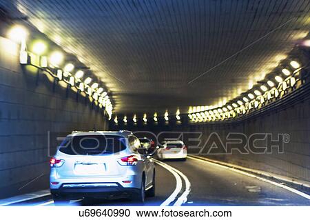 USA, New York, New York City, Manhattan, Cars riding in tunnel View Large Photo Image Stock Image - USA, New York, New York City, Manhattan, Cars riding in tunnel. Fotosearch