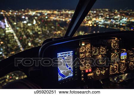 USA, New York, New York City, Illuminated skyline at night seen from helicopter cockpit View Large Photo Image Stock Image - USA, New York, New York City, Illuminated skyline at night seen from helicopter cockpit. Fotosearch