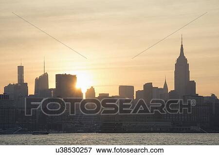 USA, New York, New York City, Sunrise over city View Large Photo Image Stock Photo - USA, New York, New York City, Sunrise over city. Fotosearch
