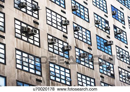 Stock Photo - USA, New York State, New York City, Air conditioners on facade of skyscraper. Fotosearch
