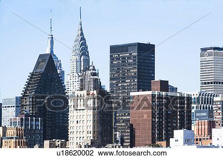 Stock Image - USA, New York State, New York City, Skyline with Empire State Building and Chrysler Building. Fotosearch