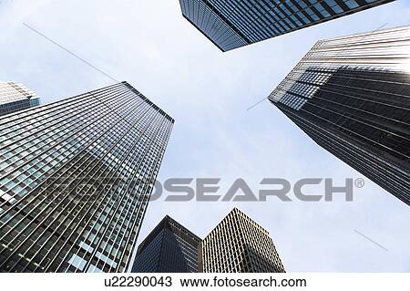Stock Image - USA, New York State, New York City, Skyscrapers seen from below. Fotosearch