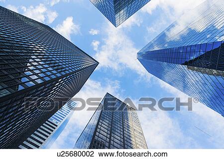 Stock Image - USA, New York State, New York City, Manhattan, Skyscrapers seen from below. Fotosearch