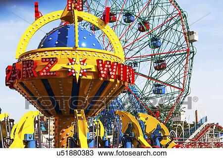 Stock Image - USA, New York State, New York City, Ferris wheel in amusement park. Fotosearch