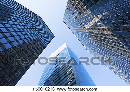 Stock Image - USA, New York State, New York City, Manhattan, Skyscrapers seen from below. Fotosearch
