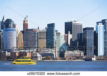USA, New York State, New York City, Manhattan, City panorama with water taxi passing by View Large Photo Image Stock Image - USA, New York State, New York City, Manhattan, City panorama with water taxi passing by. Fotosearch