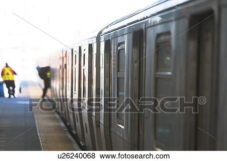 Stock Photo - USA, New York State, New York City, Subway train at subway station. Fotosearch