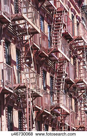 Stock Photo - USA, New York State, New York City, Fire escapes on building facade. Fotosearch