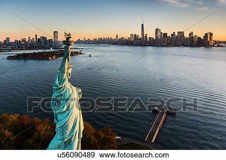 USA, New York State, New York City, Aerial view of Statue of Liberty at sunrise View Large Photo Image Stock Photo - USA, New York State, New York City, Aerial view of Statue of Liberty at sunrise. Fotosearch
