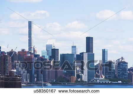 USA, New York State, New York City, Manhattan, City panorama seen across East River View Large Photo Image Stock Photo - USA, New York State, New York City, Manhattan, City panorama seen across East River. Fotosearch
