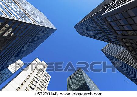 Stock Photo - USA, New York State, New York City, Manhattan, Skyscrapers seen from below. Fotosearch