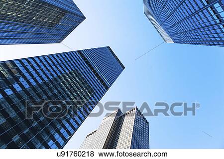 Stock Photo - USA, New York State, New York City, Manhattan, Skyscrapers seen from below. Fotosearch