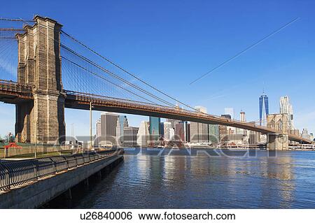 Stock Photograph - USA, New York State, New York City, Manhattan, City panorama with Brooklyn Bridge. Fotosearch
