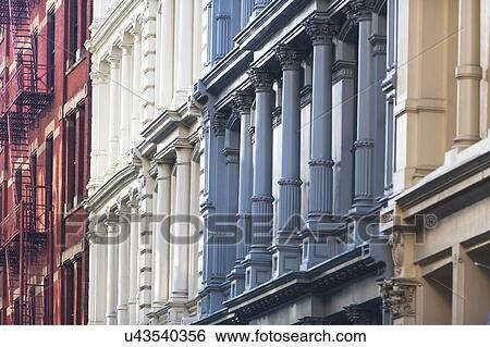 Stock Photograph - USA, New York State, New York City, Manhattan, Colorful facades of townhouses. Fotosearch