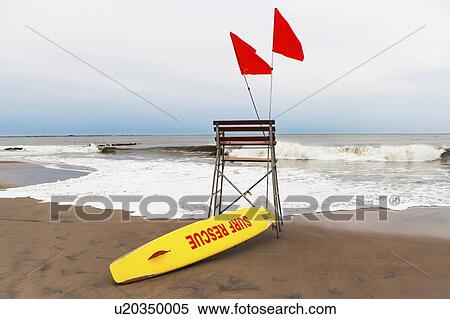 USA, New York State, New York City, Brooklyn, Yellow surfboard and empty lifeguard stand on beach View Large Photo Image Stock Photography - USA, New York State, New York City, Brooklyn, Yellow surfboard and empty lifeguard stand on beach. Fotosearch