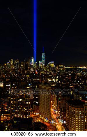 Stock Photography - USA, New York State, New York City, Cityscape with light beam over ground zero. Fotosearch