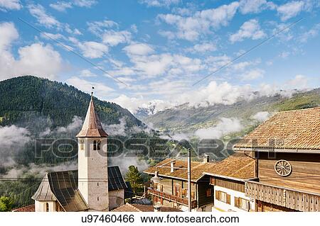 Stock Photograph - View of rooftops and low clouds, Chur, Switzerland. Fotosearch