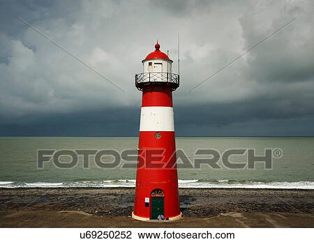 Stock Image - Westkapelle lighthouse before the rains starts falling, Westkapelle, Zeeland, Netherlands. Fotosearch