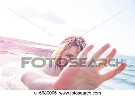 Woman covering face on beach View Large Photo Image Stock Photograph - Woman covering face on beach. Fotosearch