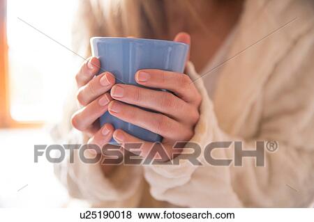 Woman holding mug View Large Photo Image Stock Photo - Woman holding mug. Fotosearch