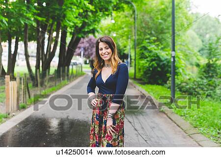 Woman posing in park View Large Photo Image Picture - Woman posing in park. Fotosearch