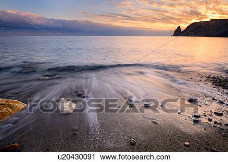 Stock Image - Yashmoviy Beach (Fiolent Beach) at sunset near Sevastopol, Crimea, Ukraine. Fotosearch