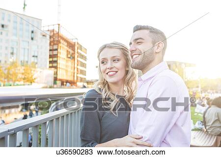 Stock Image - Young couple at Regent's Canal, London, UK. Fotosearch