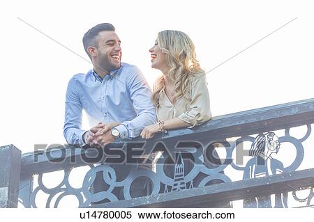 Stock Photography - Young couple on bridge at Regent's Canal, London, UK. Fotosearch
