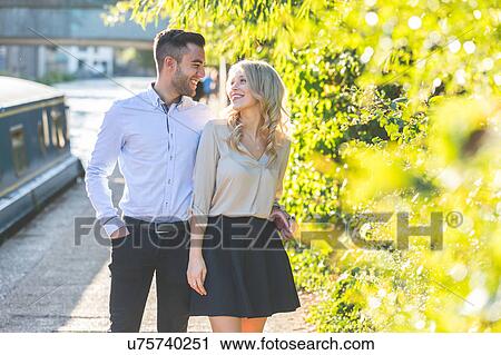 Stock Image - Young couple on Regent's Canal, London, UK. Fotosearch