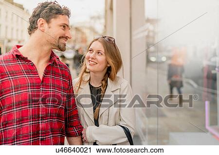 Young couple window shopping on Kings Road, London, UK View Large Photo Image Stock Image - Young couple window shopping on Kings Road, London, UK. Fotosearch